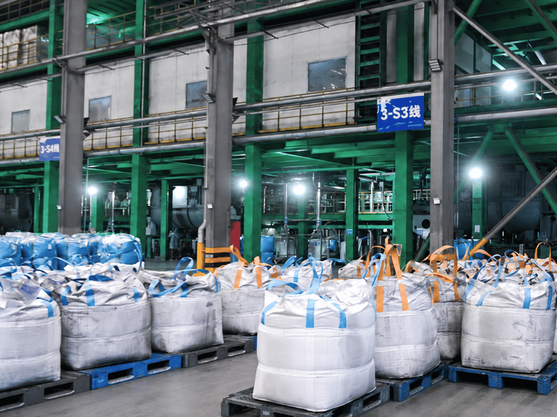 Blue plastic pallets in a beverage warehouse